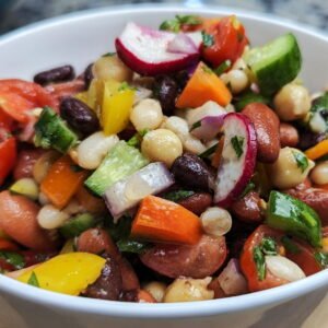 cowboy caviar in a white bowl on cutting board