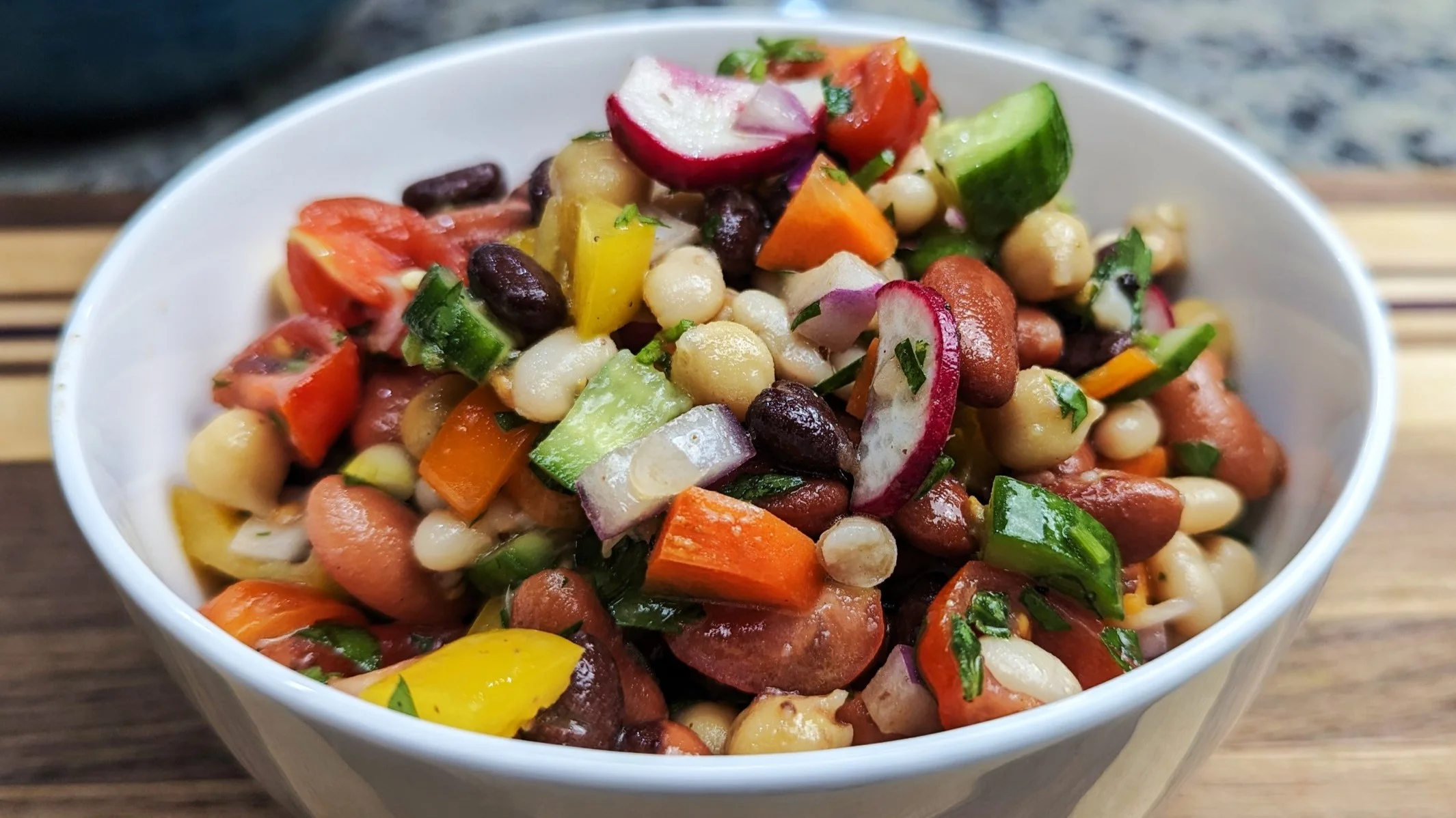 cowboy caviar in a white bowl on cutting board