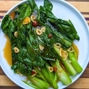Chinese Broccoli with brown sauce on white plate 2