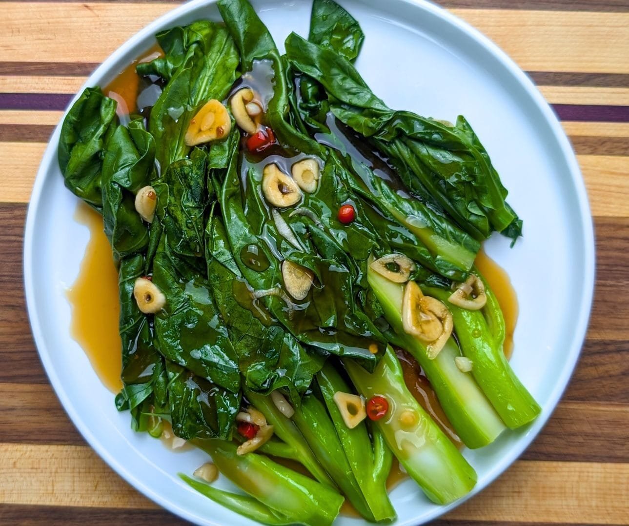 Chinese Broccoli with brown sauce on white plate 2