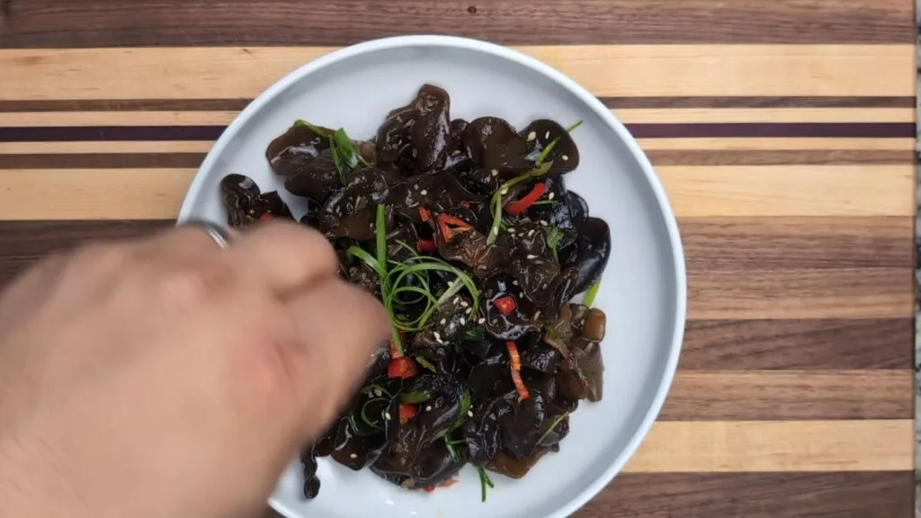 sesame seeds garnish on a wood ear mushroom salad