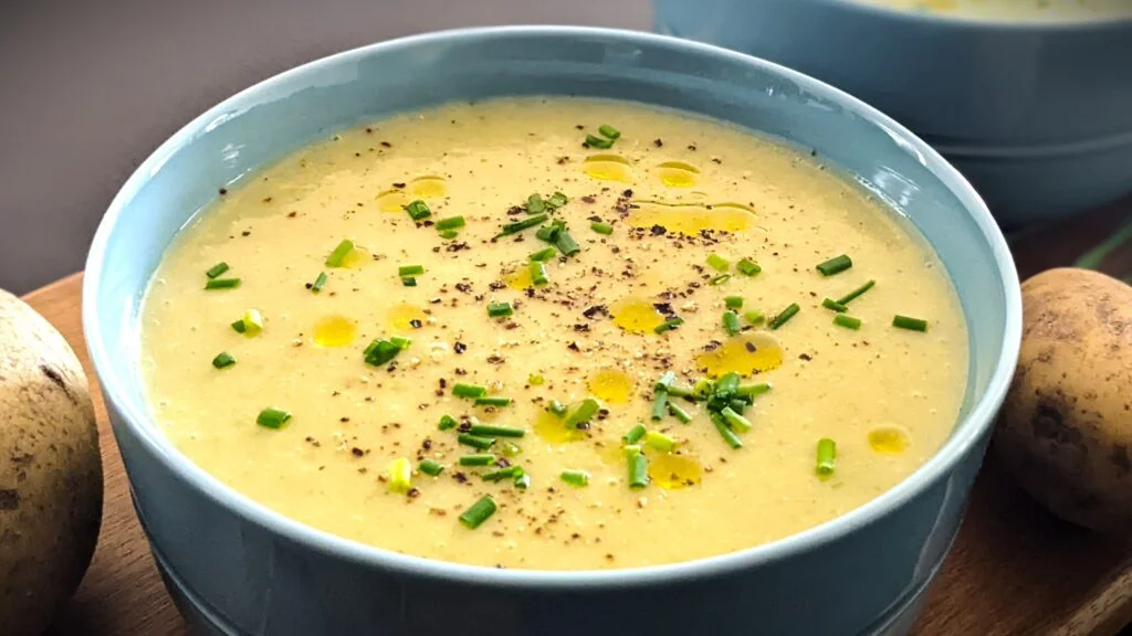 Leek Potato Soup in a bowl with Chives and Truffle oil