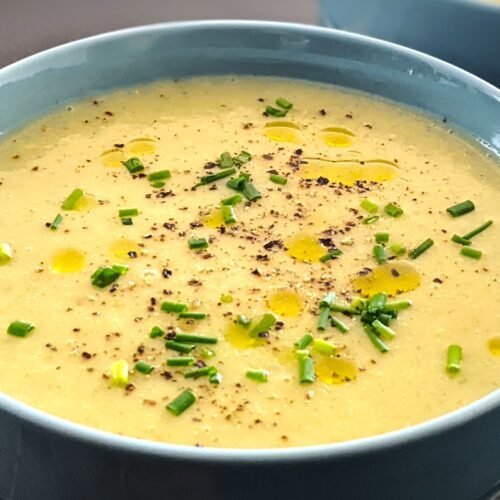 Leek Potato Soup in a bowl with Chives and Truffle oil