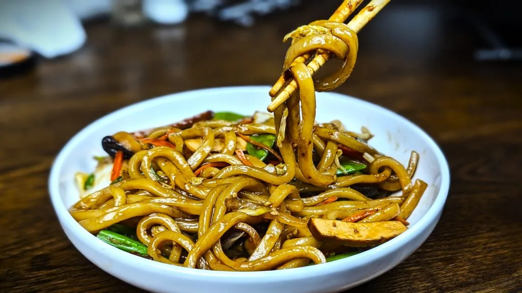 Yaki Udon Noodles Stir Fry in a white bowl
