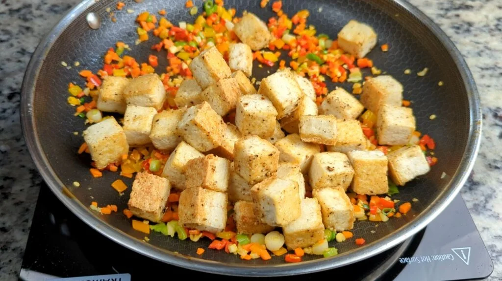 Fried Tofu in Frying Pan atop veggies