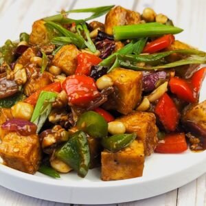 Kung Pao tofu served on a white plate