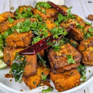 Paneer 65 is in a White Plate