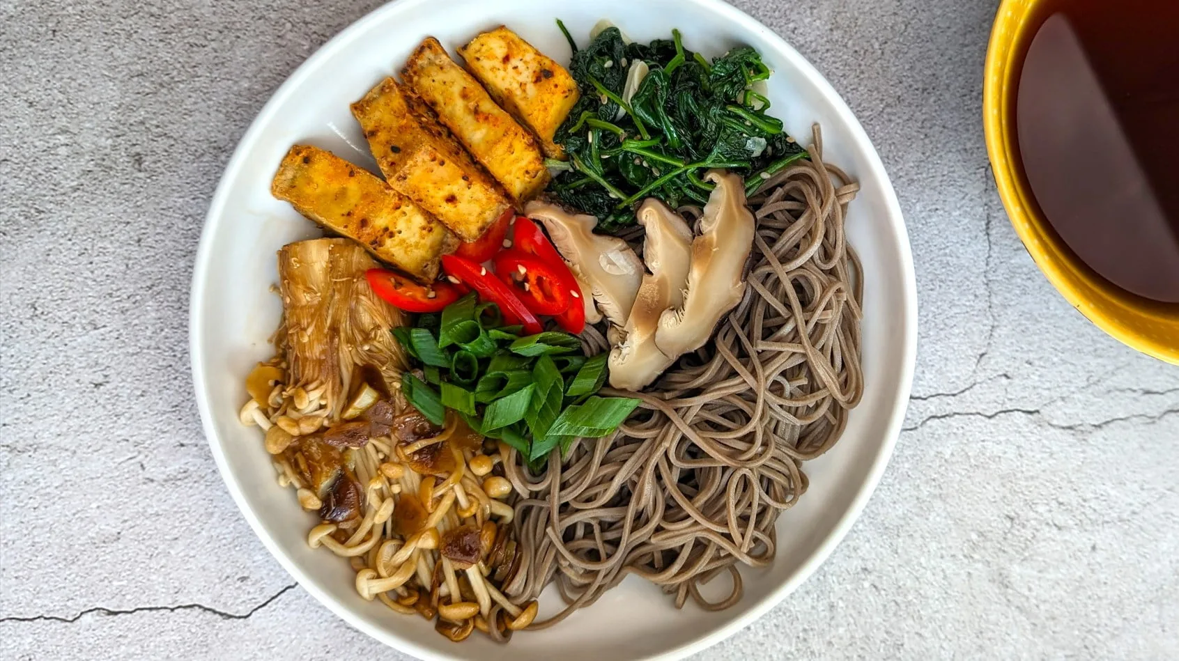 Toshikoshi Soba noodles with dipping sauce and other toppings