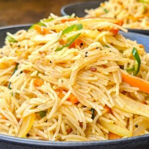 Vermicelli Upma plated in a grey bowl