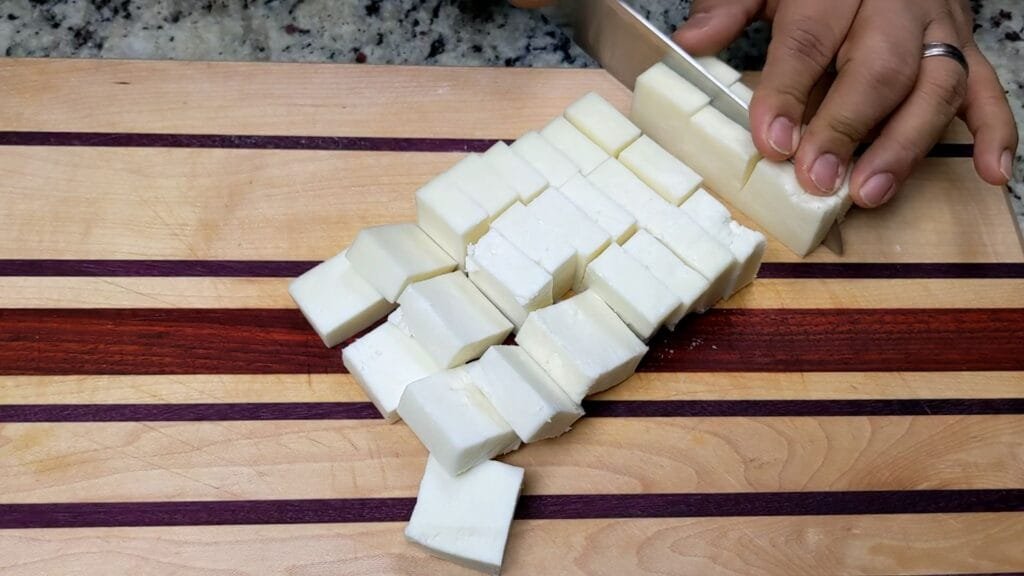 cutting paneer in desired size to make Paneer 65