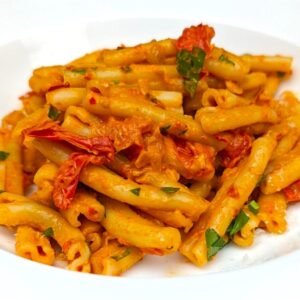 Spicy Harissa Pasta served in a white plate