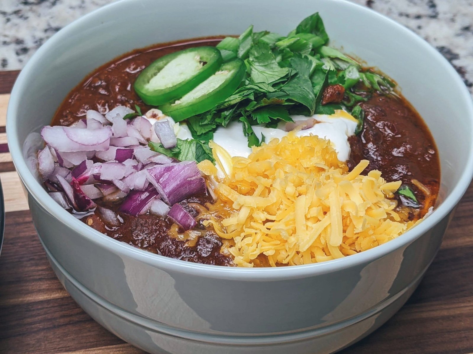 Vegan Chili in bowl with toppings