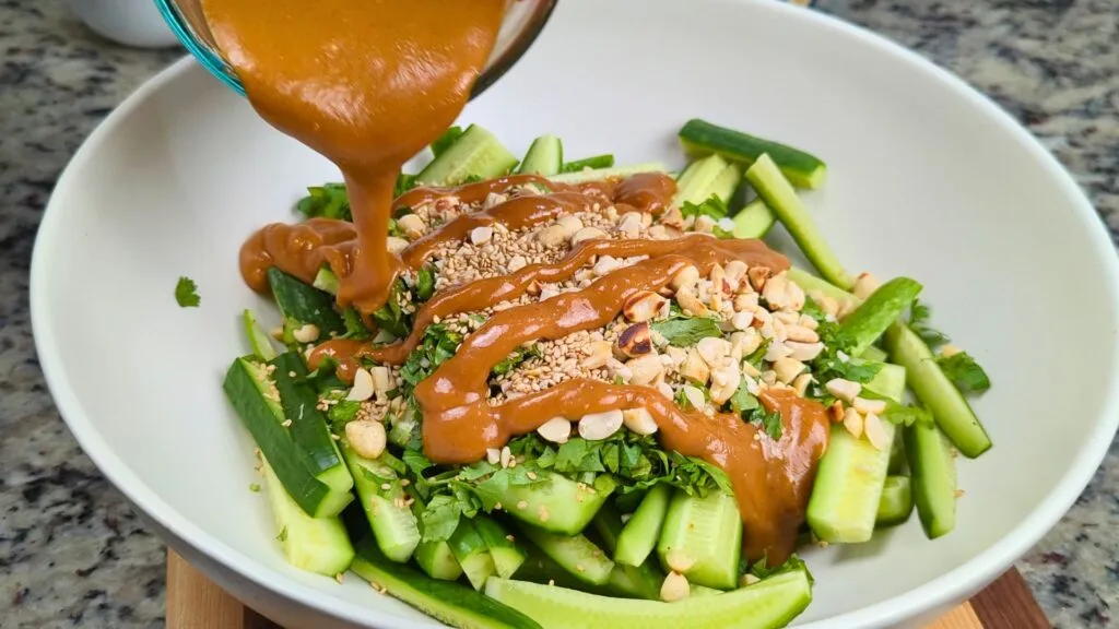 Adding dressing on Cucumber salad