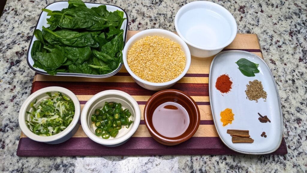 Spinach and Lentil dal ingredients on a cutting board