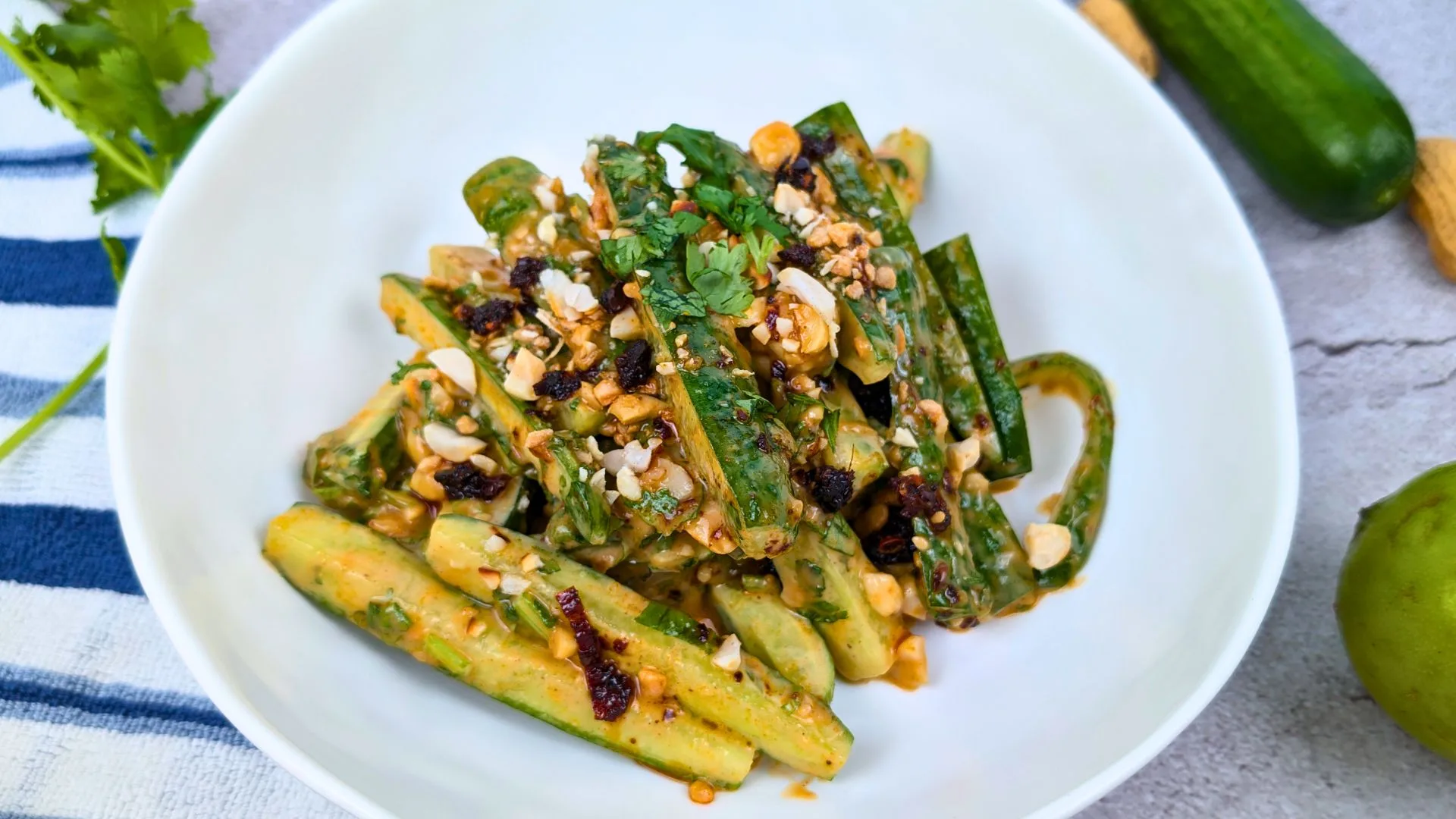 Peanut and Chili Oil Cucumber Salad served in a white bowl