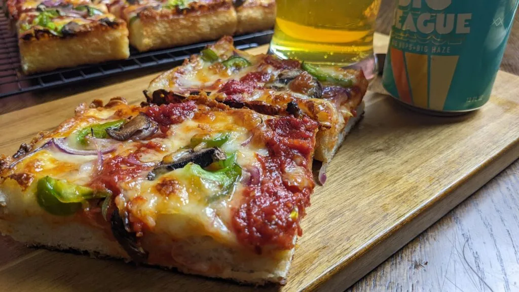 Enjoy Detroit Style Pizza with a cold beer
