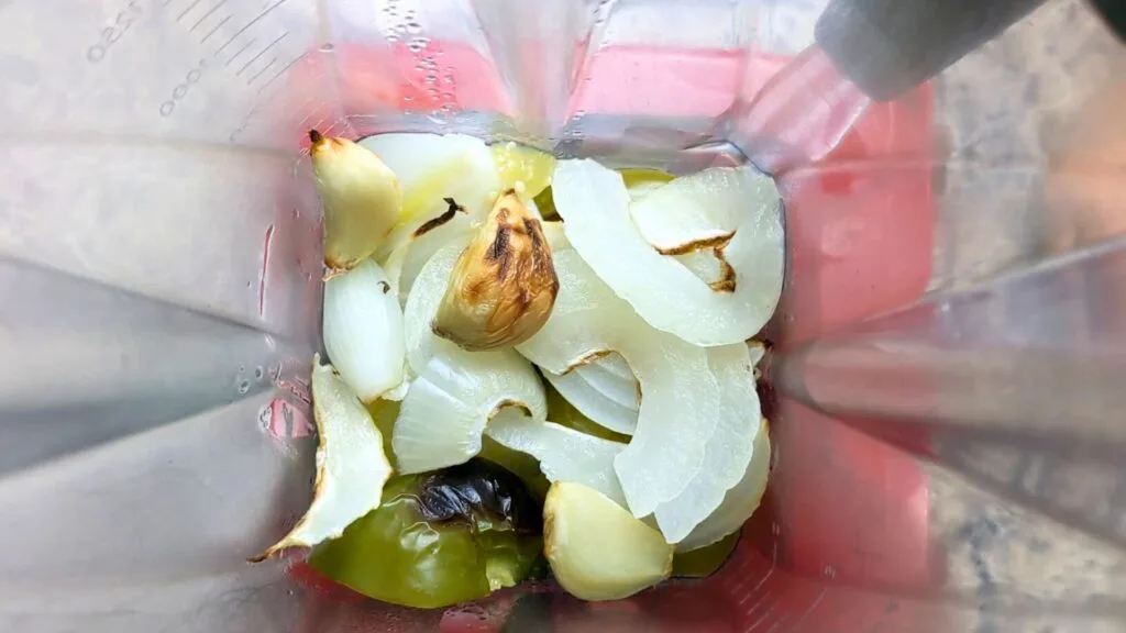 Blend Tomatoes, Onion garlic and Adobo chilis in the blender
