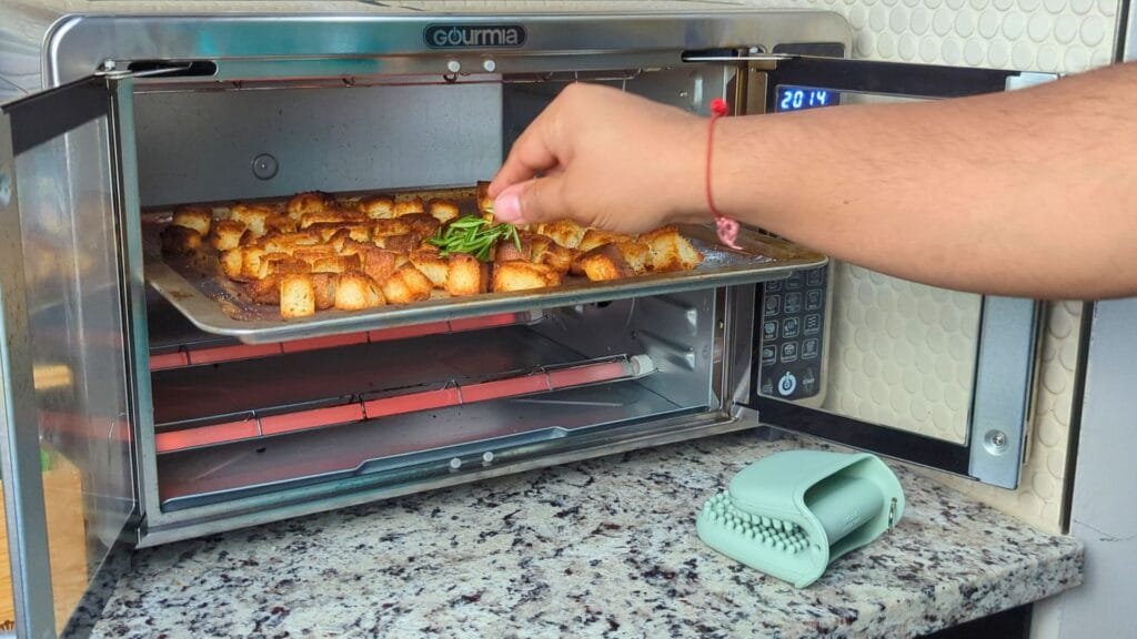 putting olive oil rosemary to the air fryer tray