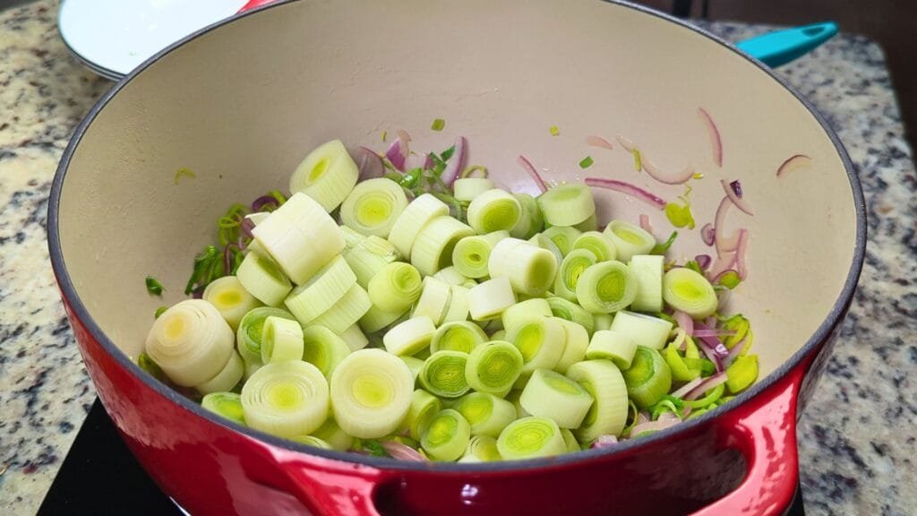 Adding white rings of Leeks in to the hot pot