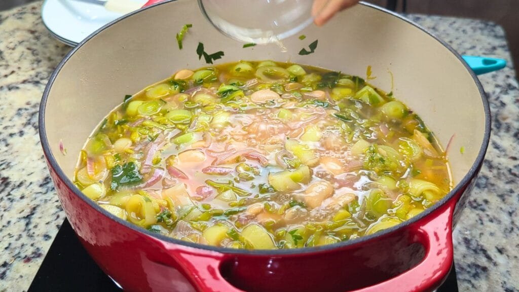 adding Apple Cider Vinegar to the soup