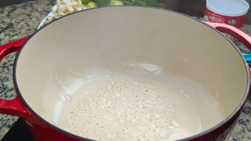 Thick Coconut milk in a red Dutch oven
