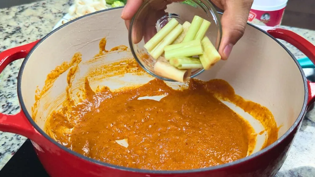 adding Lemon grass to the curry paste