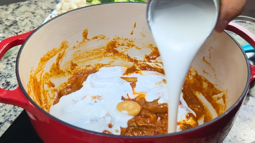 adding coconut milk