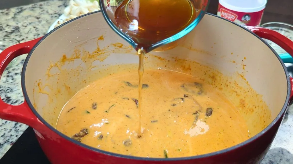 adding vegetable stock