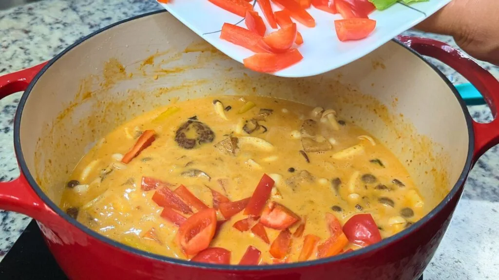 add bell red pepper to the curry paste