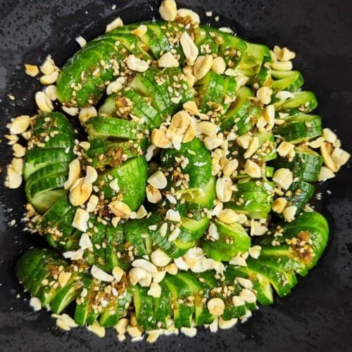 Wasabi Cucumber Salad in a black bowl