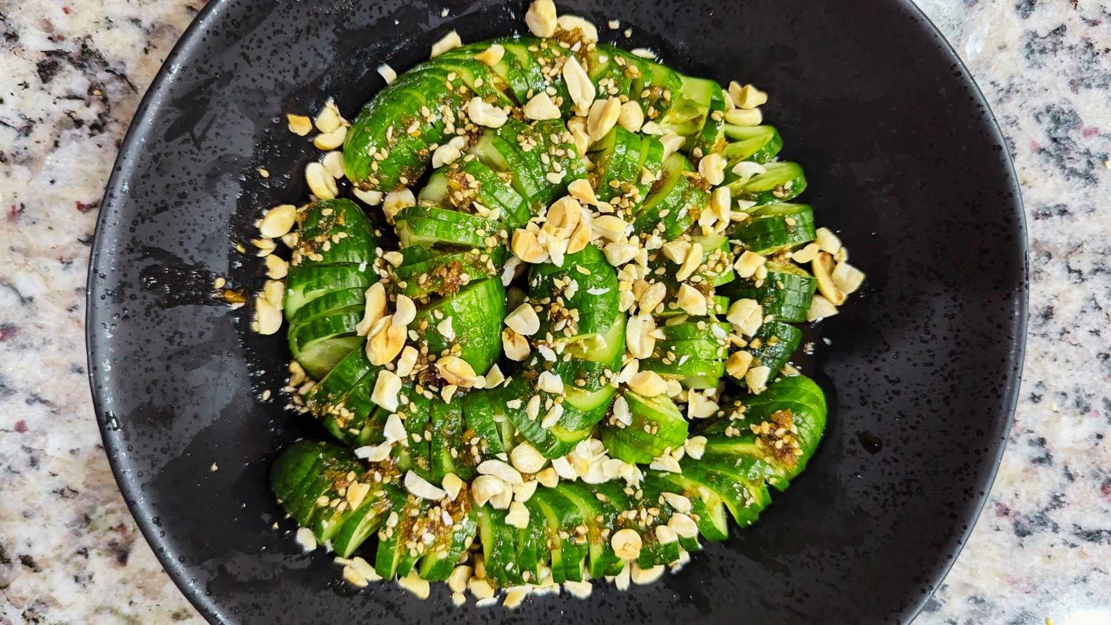 Wasabi Cucumber Salad in a black bowl
