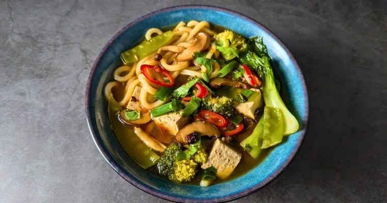 Tofu Udon Noodle Soup With Mushrooms and Vegetables