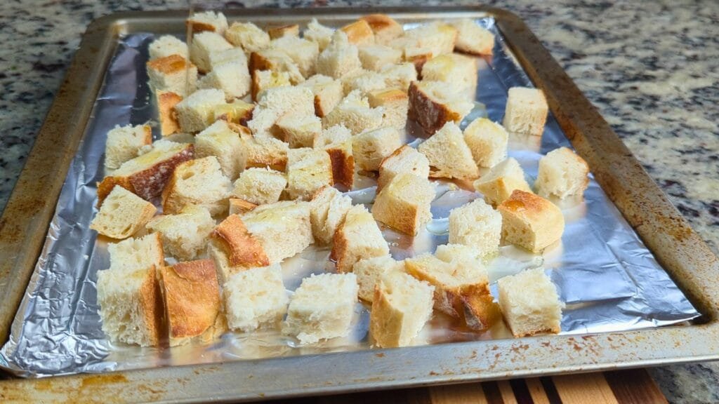 transfer bread cubes to an air fryer tray