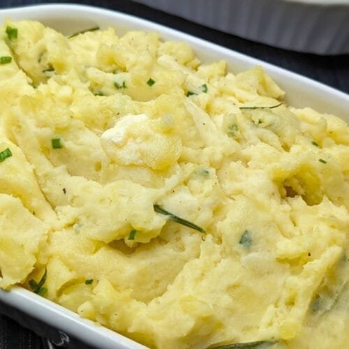 Creamy Mashed Potatoes Served in a white Casserole plate