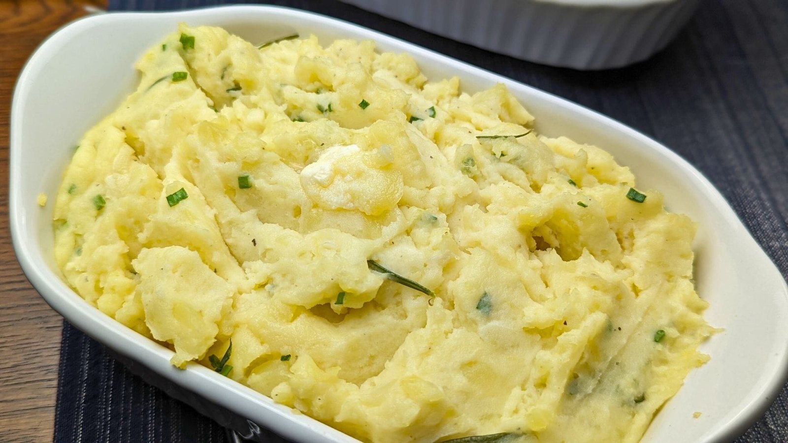 Creamy Mashed Potatoes Served in a white Casserole plate