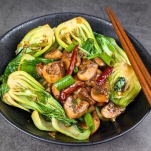 Mushroom and Bok Choy Stir Fry served in a black bowl