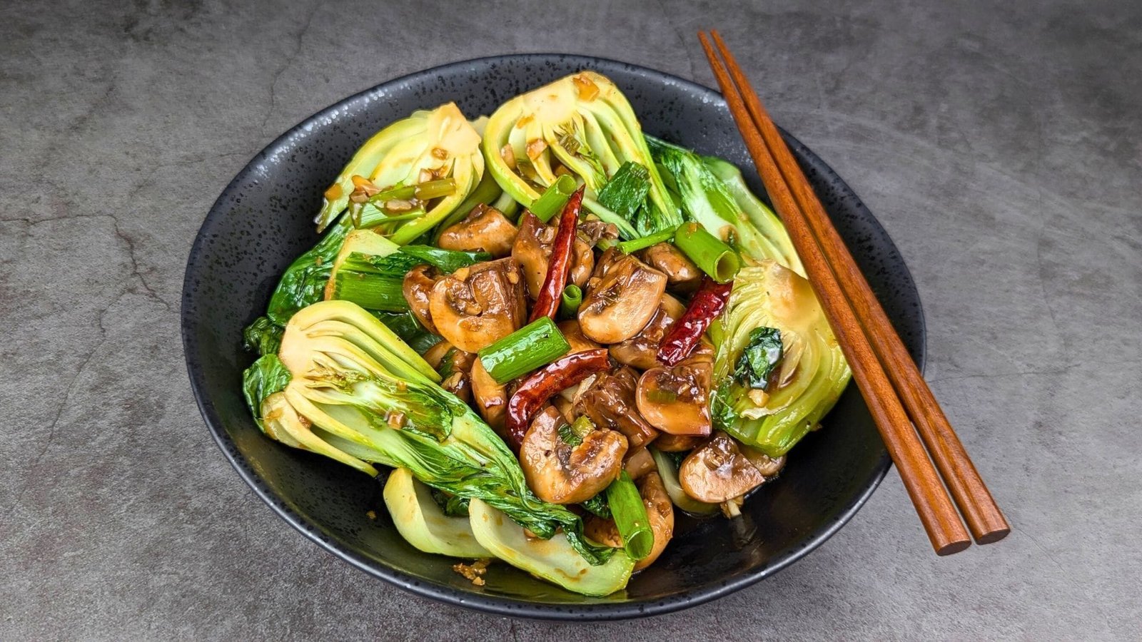 Mushroom and Bok Choy Stir Fry served in a black bowl