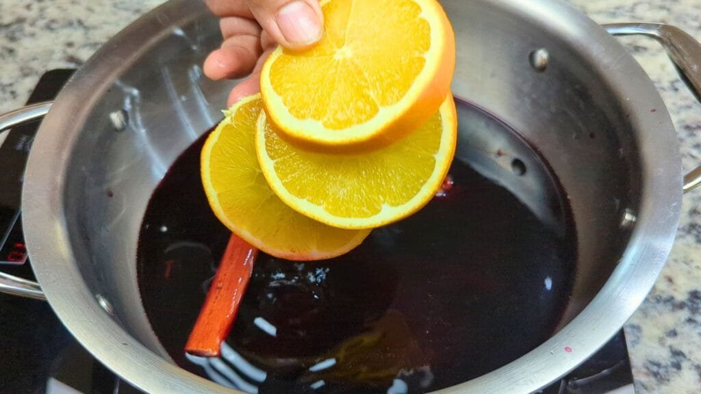 add Orange slices to wine