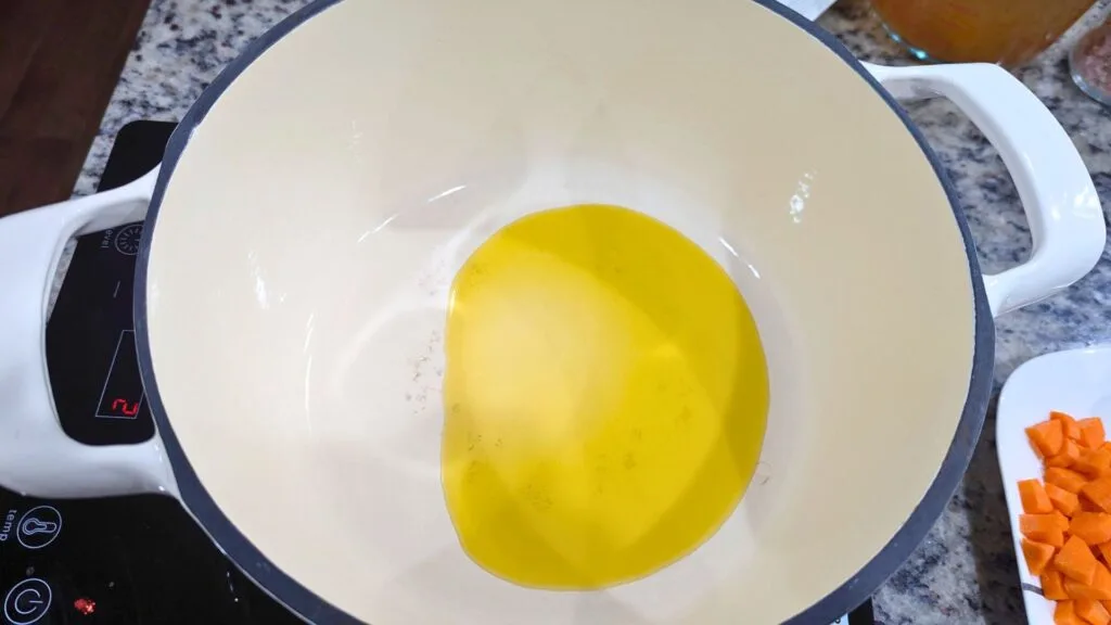 adding EVOO in a Dutch Oven