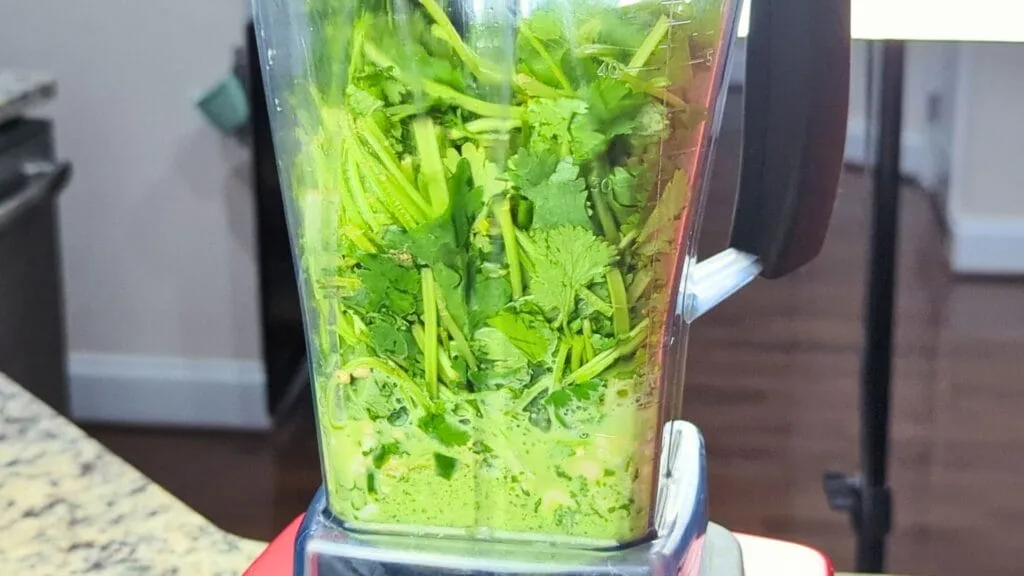 adding ingredients in a blender