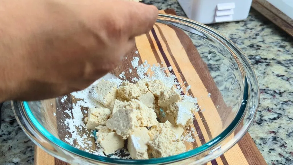 break tofu with hannds