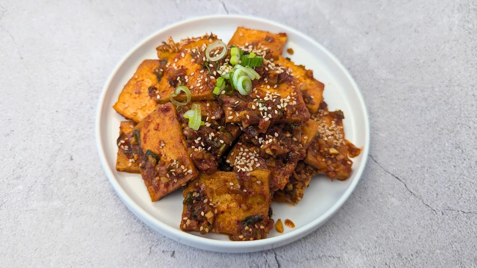 Spicy Braised Tofu (Dubu-Jorim) Served in a white plate