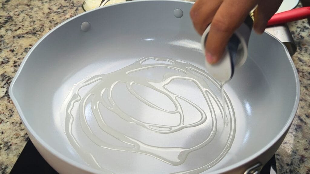 adding oil to the pan
