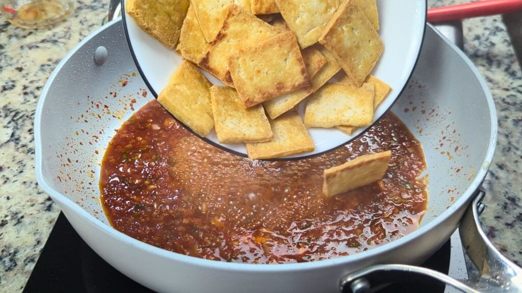adding Tofu to the sauce