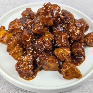 Sesame Tofu served in a white plate