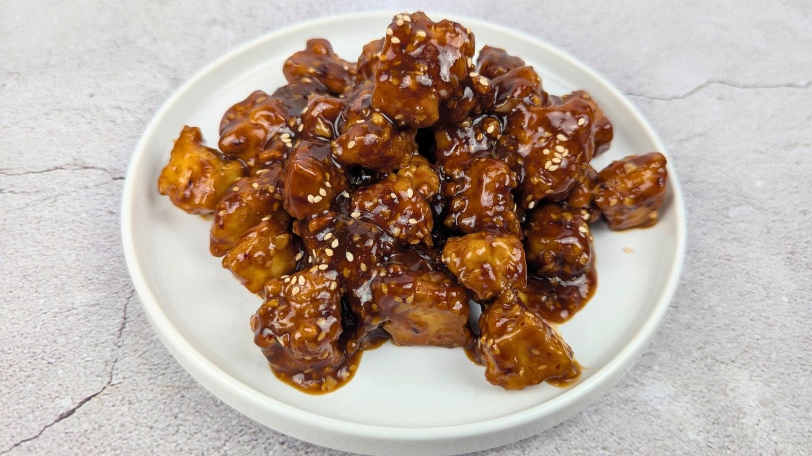 Sesame Tofu served in a white plate