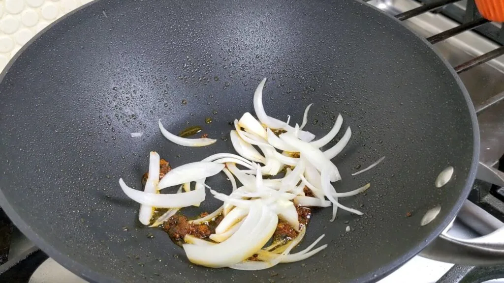 Adding Onions to the wok