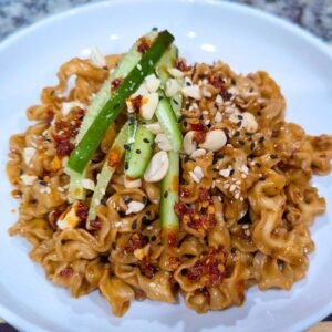 Spicy Peanut Noodles Served in a White plate