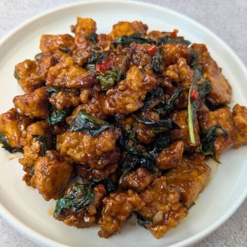 Thai Basil Tofu Stir-Fry (Pad Krapow) is served in a White plate
