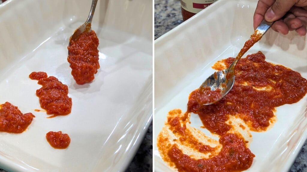 Spread the spoon full of Marinara sauce in the baking sheet.